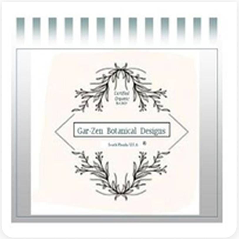 A decorative sign with floral designs reads "Gar-Zen Botanical Designs" with "Certified Organic" and "South Florida USA" in smaller text. The background features vertical stripes above the sign.