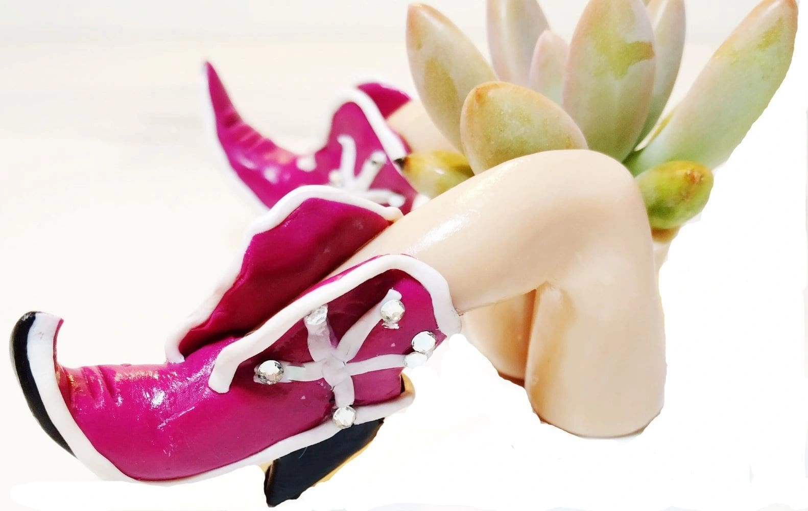 A close up of a pair of shoes with flowers