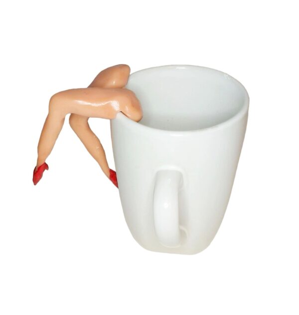 A cup with legs and red nails on top of it.