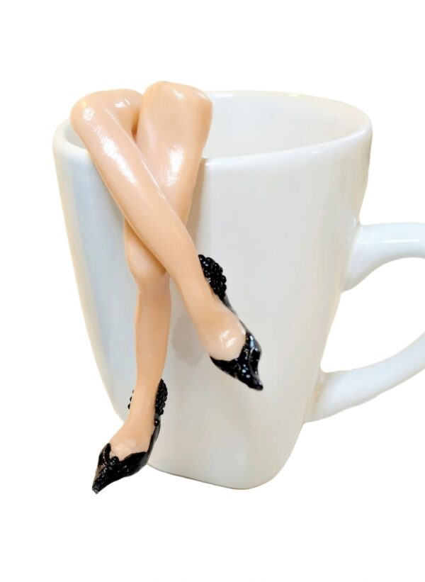A cup with legs and high heels on it