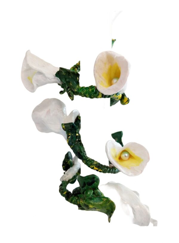 A white flower with green leaves on it.