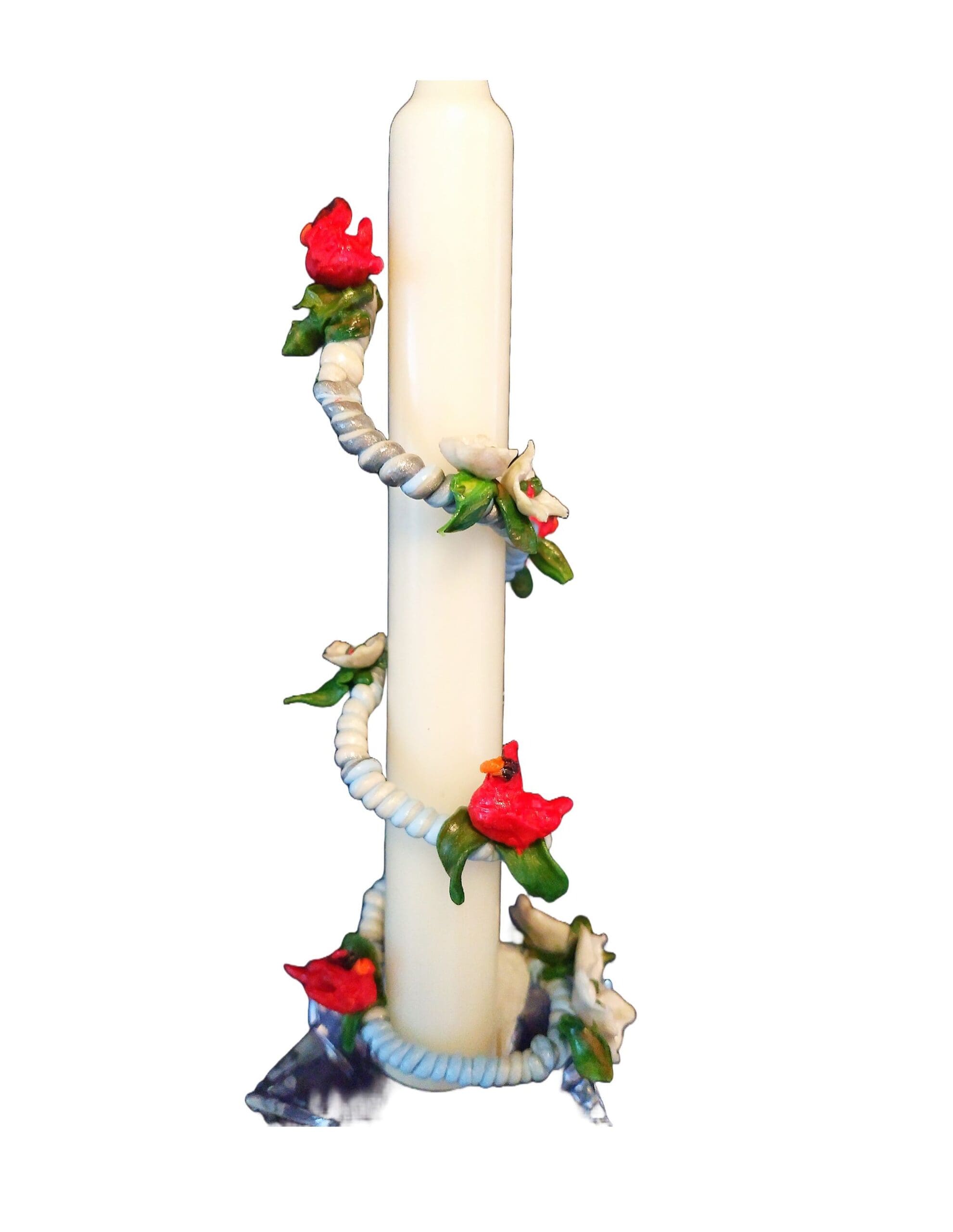 Decorative candle with red flower accents.