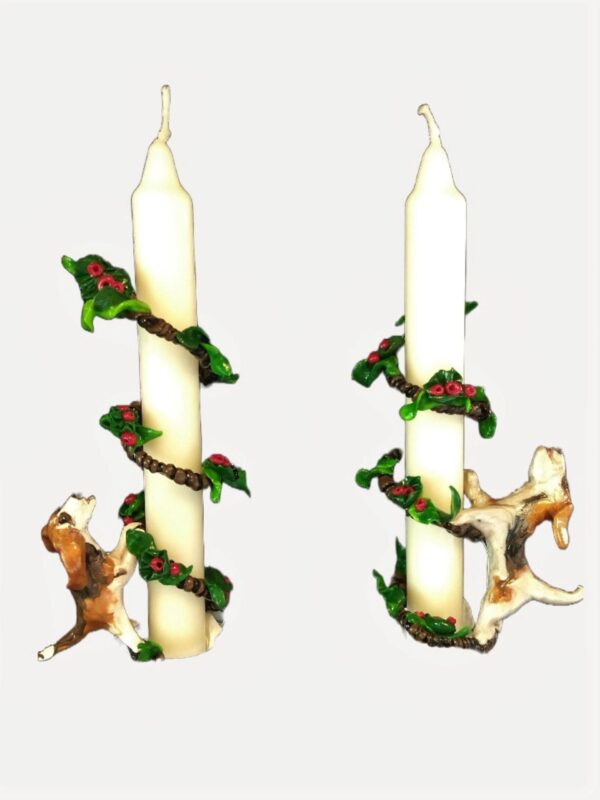 A pair of candles with animals on them