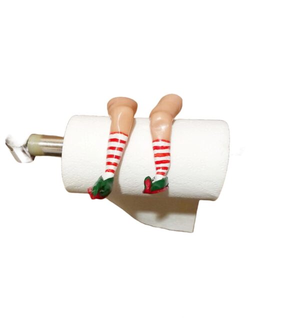 A toilet paper holder with legs and stockings on it.