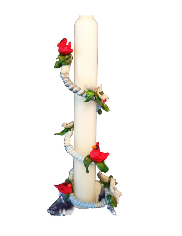A candle with roses on it