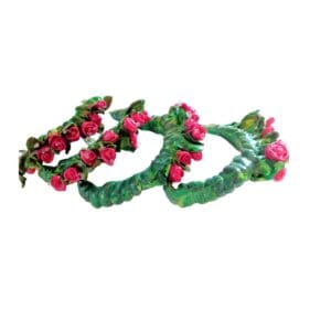A pair of green and pink bracelets with flowers.