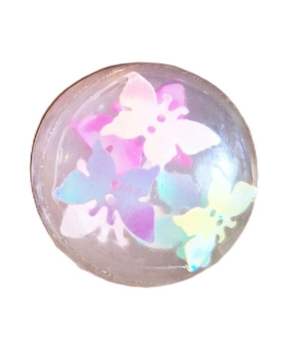A white ball with iridescent flowers on it.