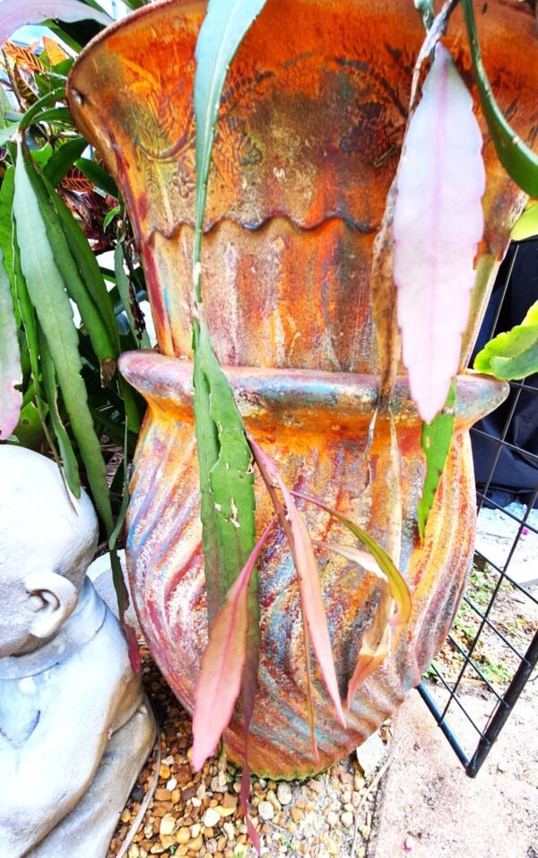 A close up of the bottom of an old vase
