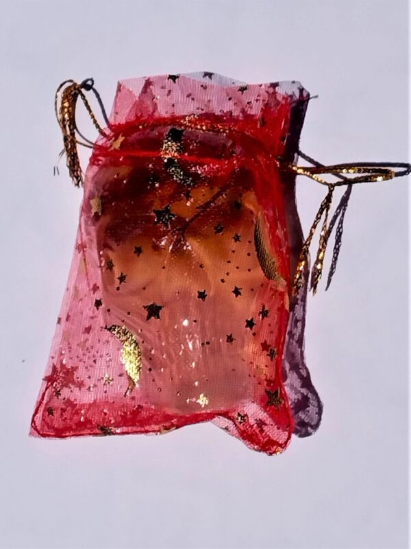 A red bag with gold leaf on it.