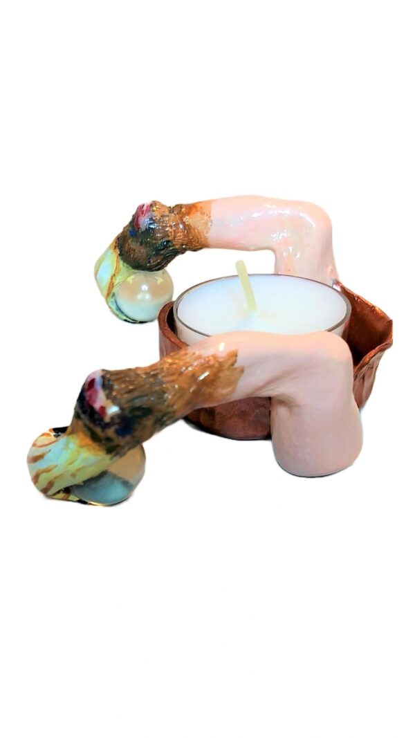 A candle is sitting on top of a wooden bowl.