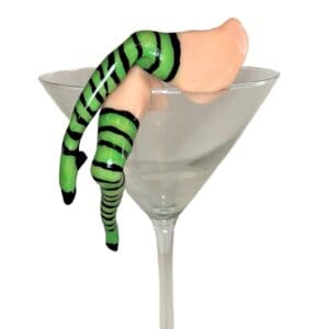 A green striped leg and foot in a glass