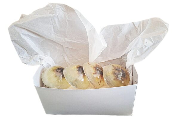 A box of donuts with white paper on top.