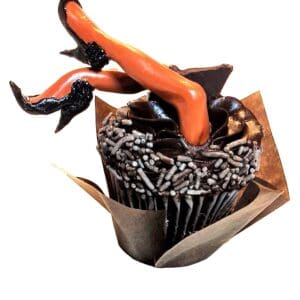 A cupcake with chocolate frosting and orange heels.
