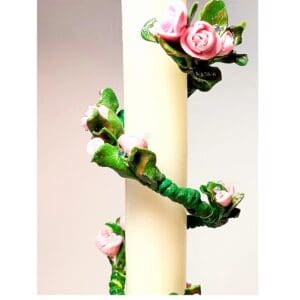 A close up of the flowers on a candle